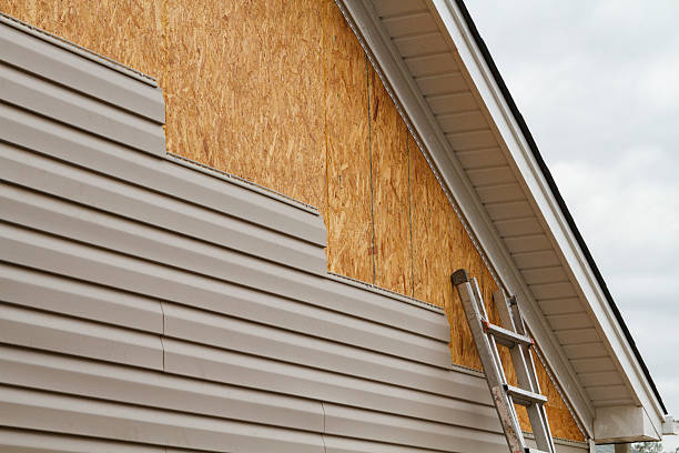 Professional Emergency Siding Repair technician working in Monroe, OH